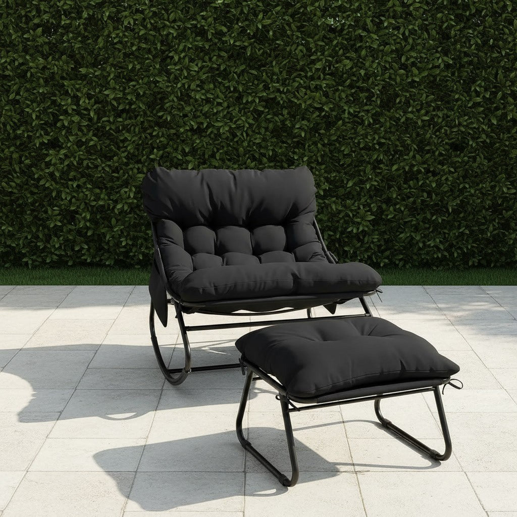 Fauteuil à Bascule Extérieur avec Repose-Pieds noir sur un patio de jardin